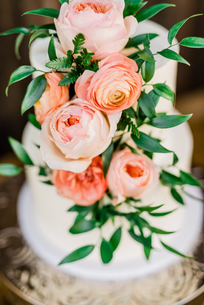 Colorful flowers on a wedding cake during an Ellas Vineyard wedding reception.