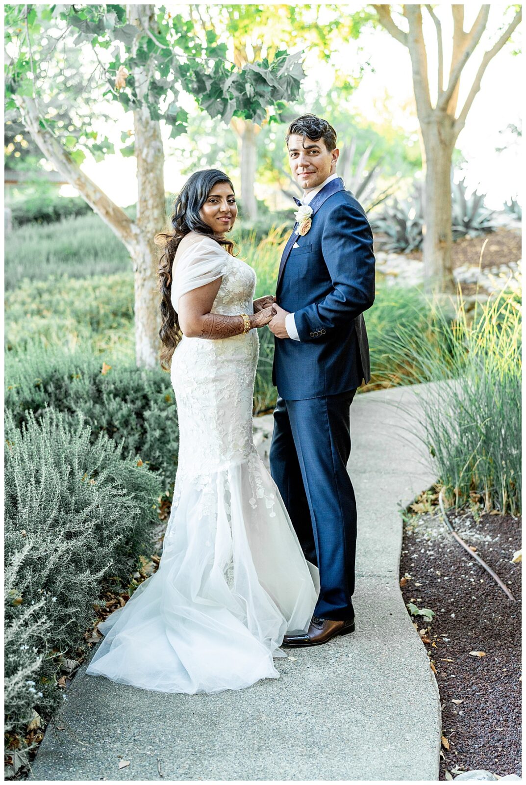 A bride and groom in traditional wedding attire at Willow and Oak Estate in a light and airy photography style.