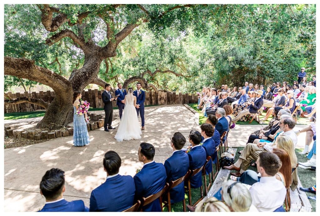 Wedding ceremony under giant oak tree at Hartley farms, a Paso Robles garden wedding venue.