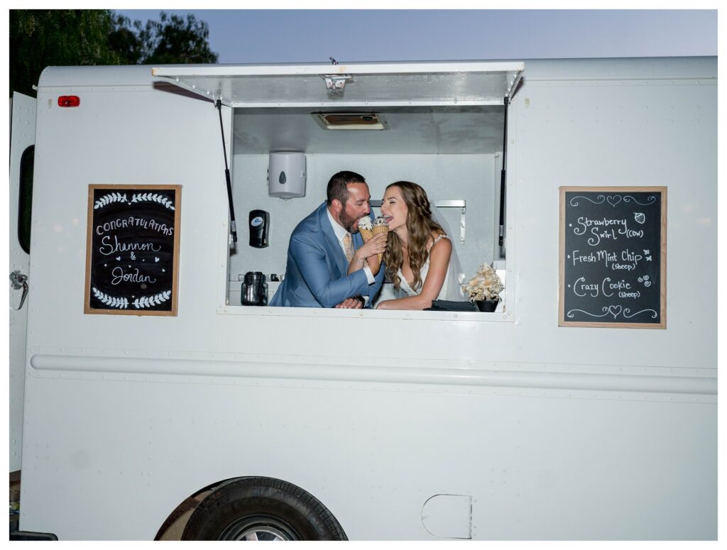 Bride and groom enjoying ice cream at food truck at Greengate Ranch - Paso Robles | Leana Myra Photography