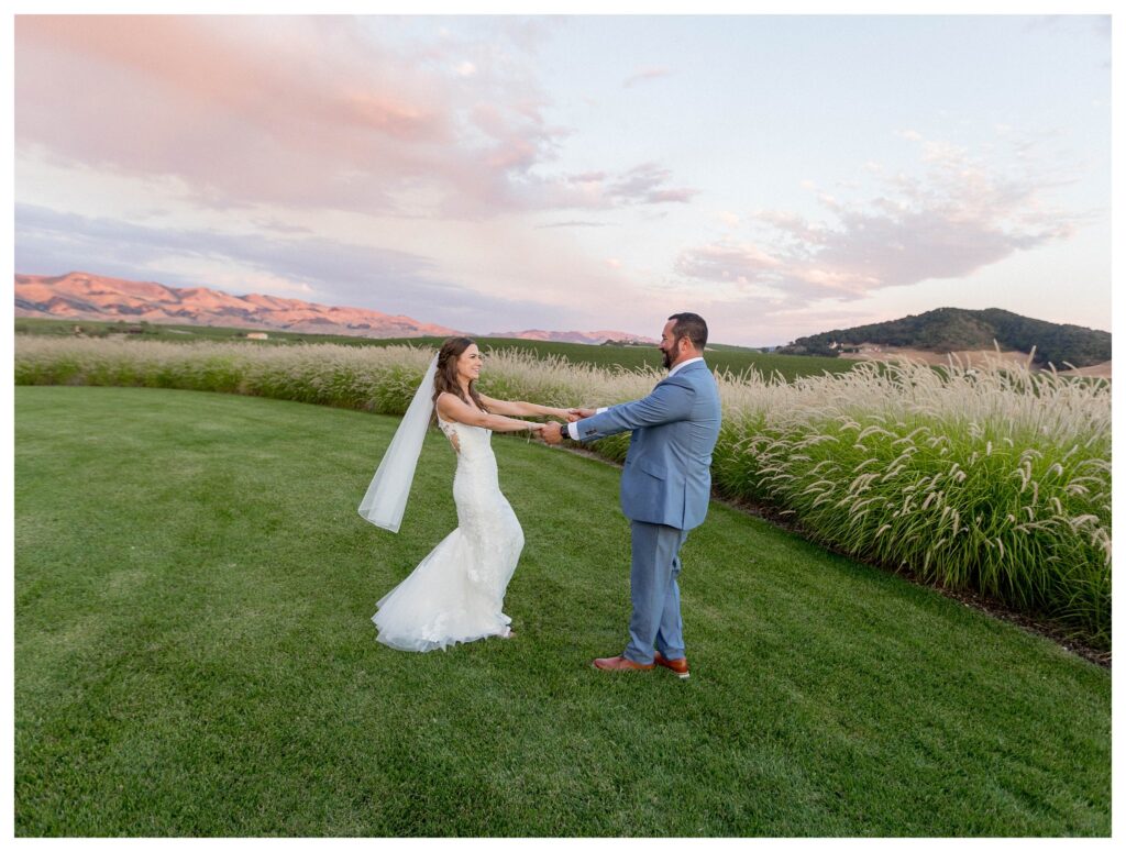 Bride and groom dancing in vineyard at sunset at Greengate Ranch - Paso Robles | Leana Myra Photography