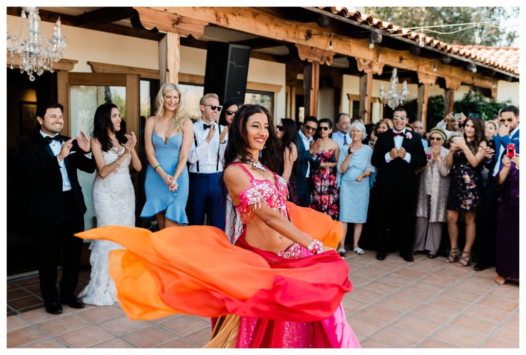A belly dancer at a Persian wedding at the Casitas Estate a luxury garden wedding venue in san Luis Obispo.