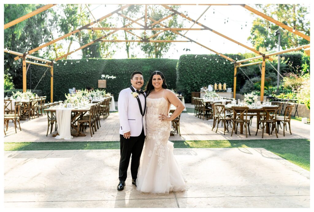 Bride and groom in greenhouse at luxury Maravilla gardens wedding.
