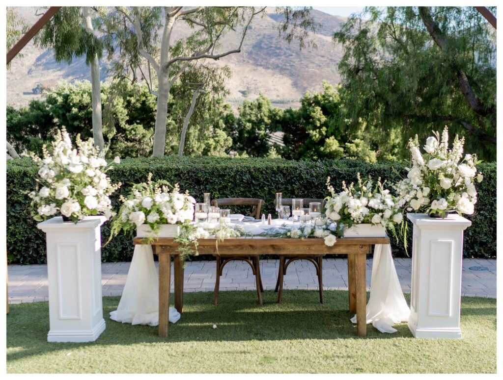 Romantic sweetheart table with lush white flowers at Maravilla Gardens in Camarillo.

