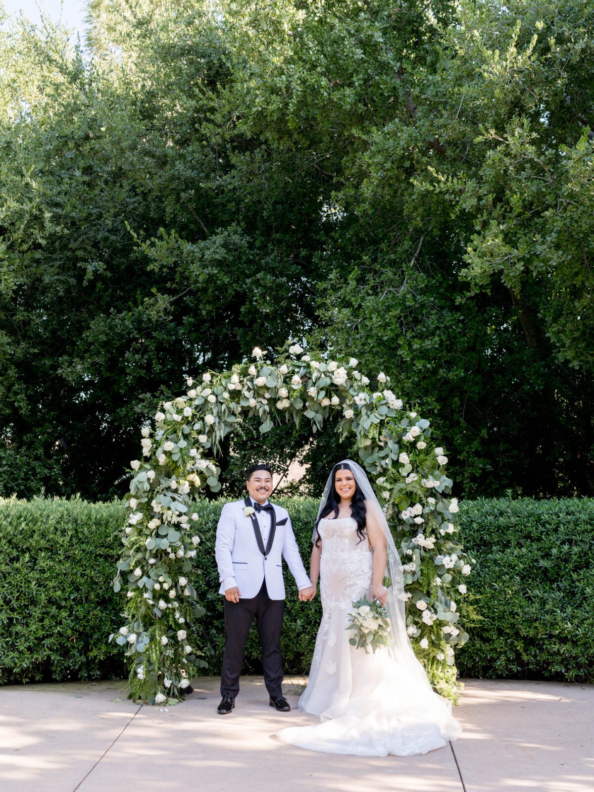 Romantic floral arch at Maravilla Gardens ceremony site