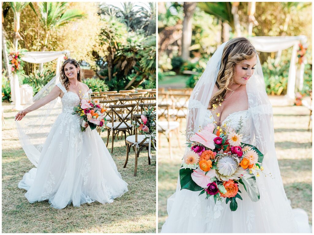 A bride stands in front of her ceremony arch, holding a colorful bouquet of tropical flowers at the Santa Barbara zoo during her California colorful wedding day.