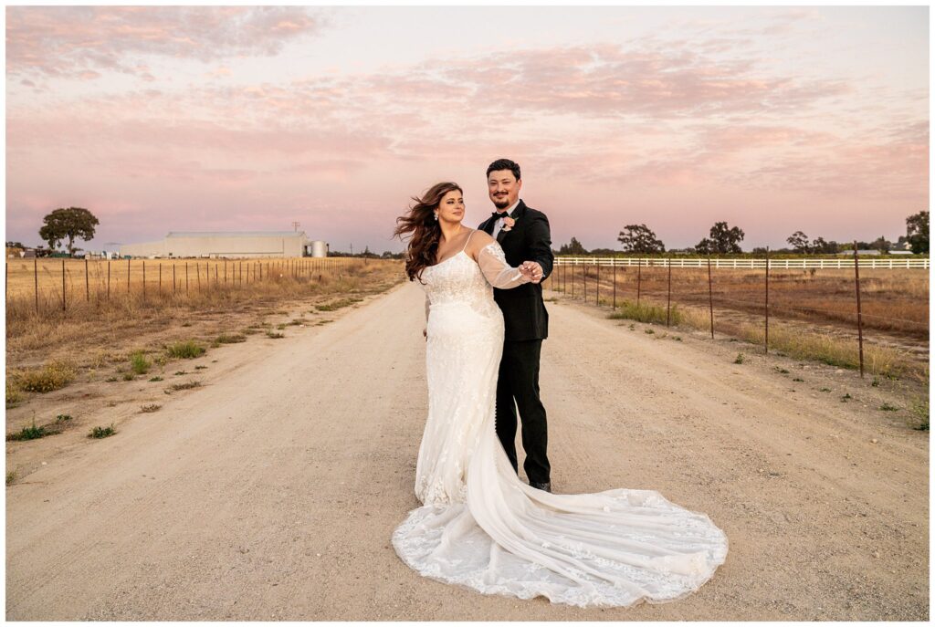 Bride and Groom in the Vineyards in Paso Robles at Sunset during a luxury wedding day.