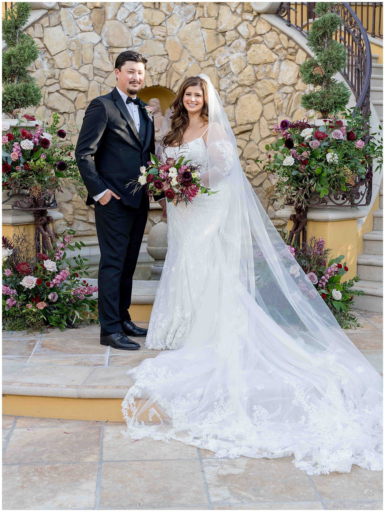 Bride and groom wedding portrait at a Paso Robles venue with lush florals, captured with romantic elegance by Leana Myra Photography.