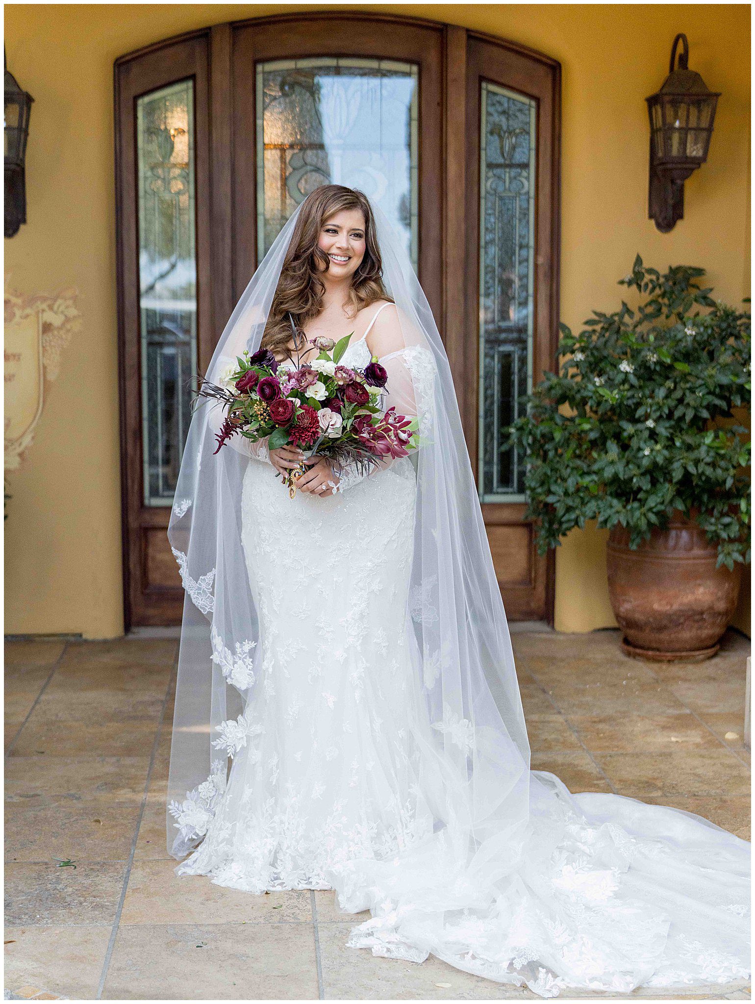 Bride holding bouquet and smiling before the ceremony in Paso Robles, captured by Leana Myra Photography.