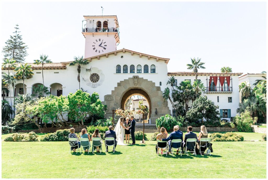 A wedding ceremony on the Palm Terrace at the Santa Barbara courthouse.