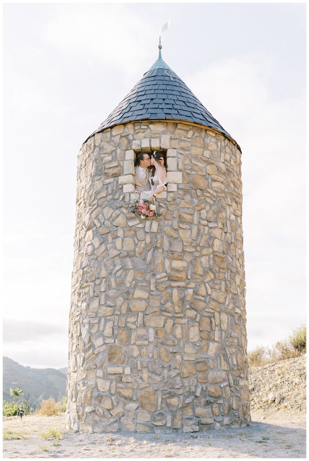 Romantic wedding at Chatuea Noland with bride and groom kissing in the tower.