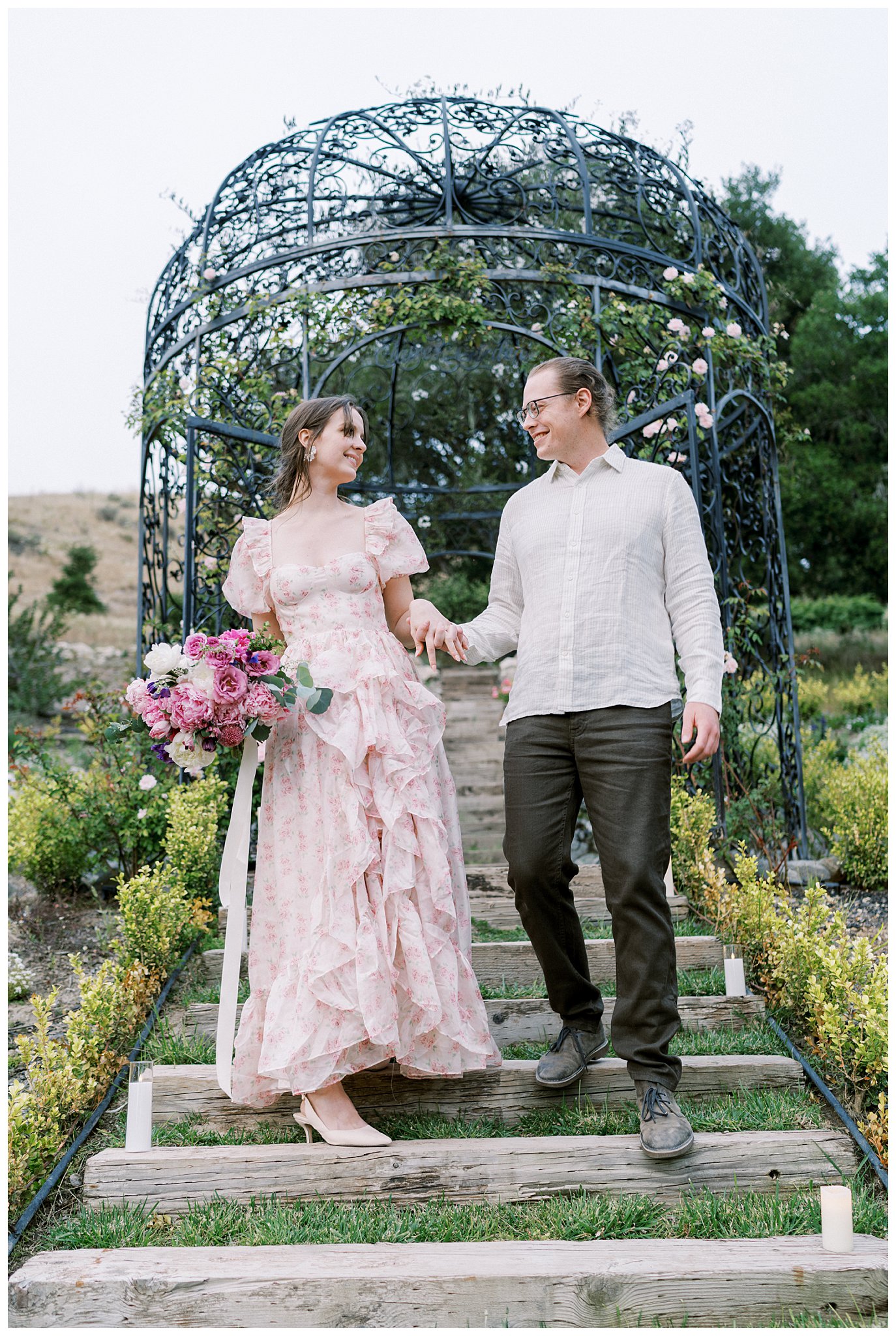 Bride and groom in Romantic wedding attire at chateau Noland in front of the gazebo, a fairytale wedding venue in california