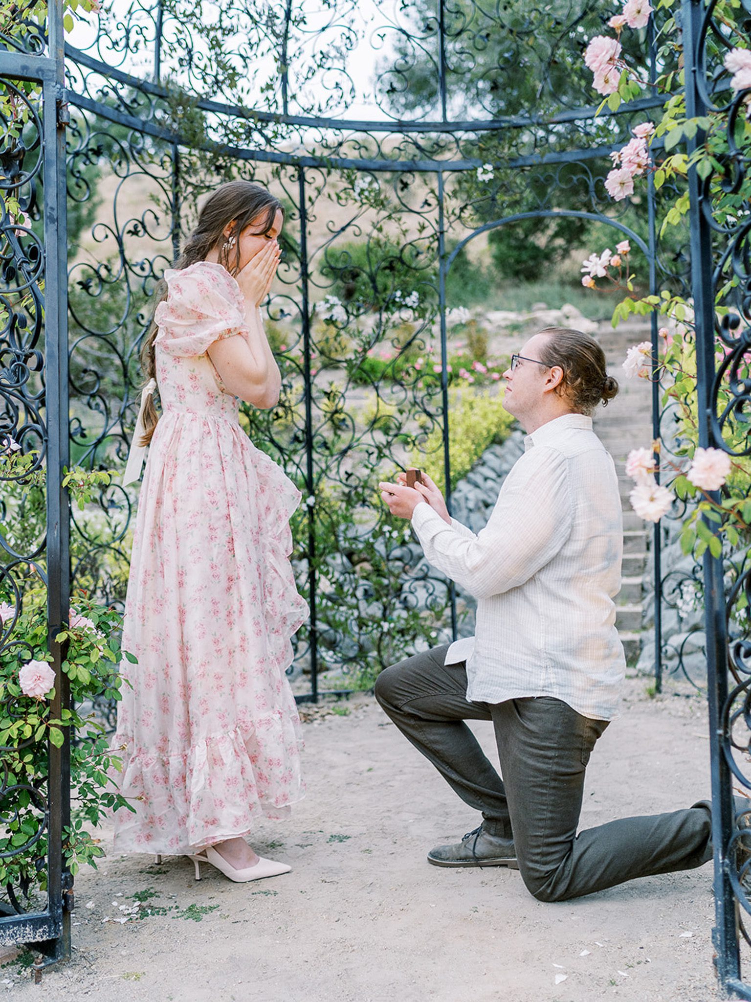 man proposes to woman at a castle wedding venue in california