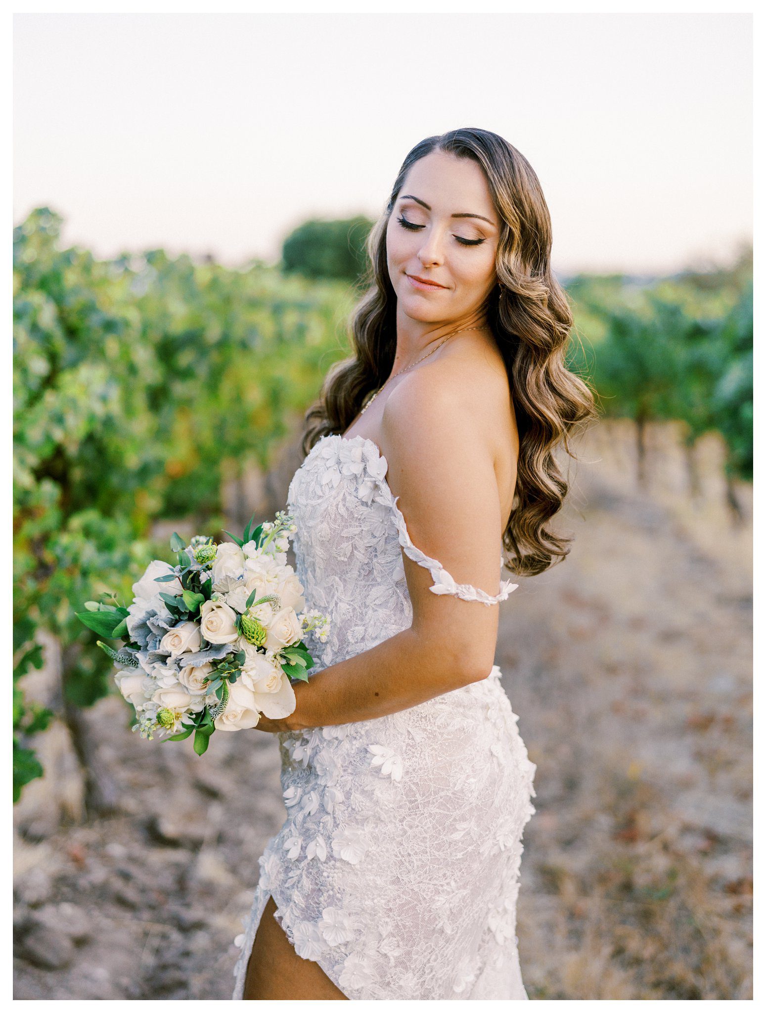 Elegant bridal portrait with bouquet in California vineyard